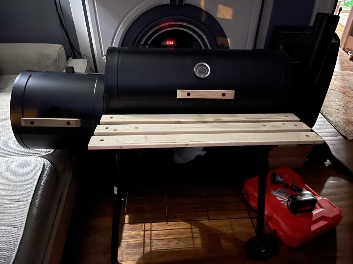 Add the 2 brackets to hold legs on before installing the bottom rack