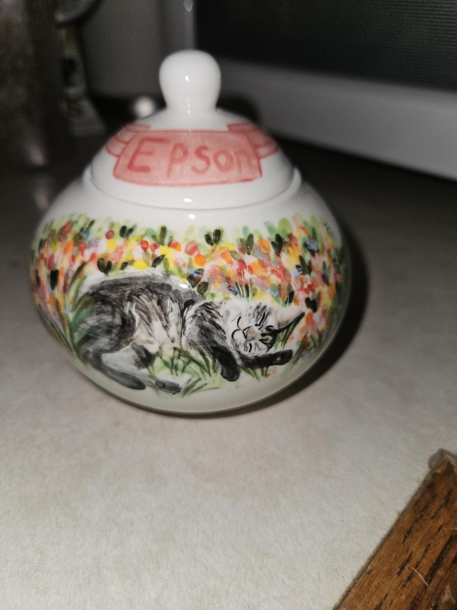 Beautifully painted. The urn itself is a little too small to hold his ashes, but he was a big cat. All in all, Its a gorgeous tribute to the light of my life.