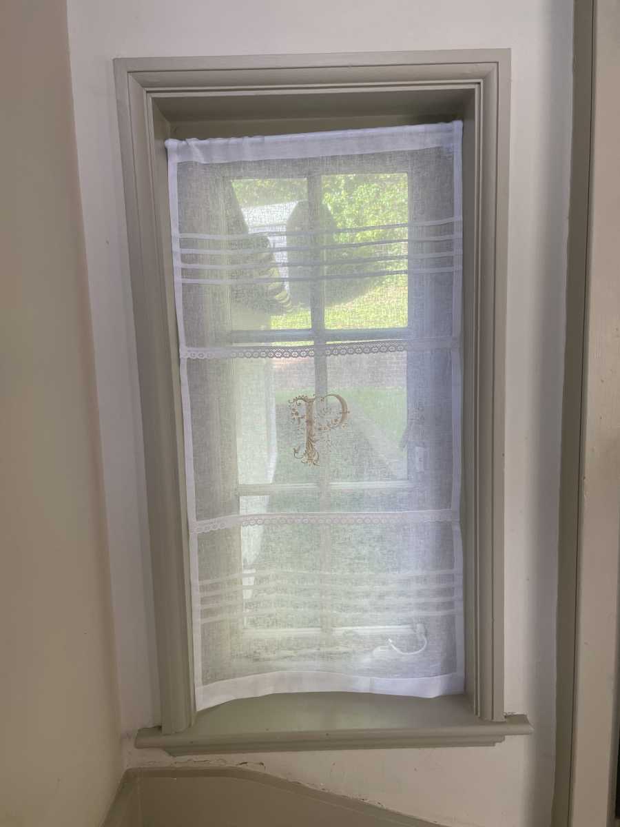 Two curtain panels with monogram